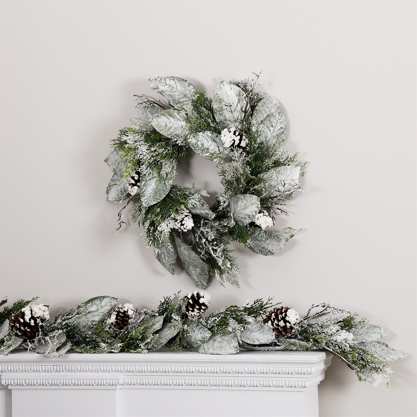 22-inch-wreath featuring cedar and magnolia leaves in lush green plastic suitable for festive indoor or covered outdoor display