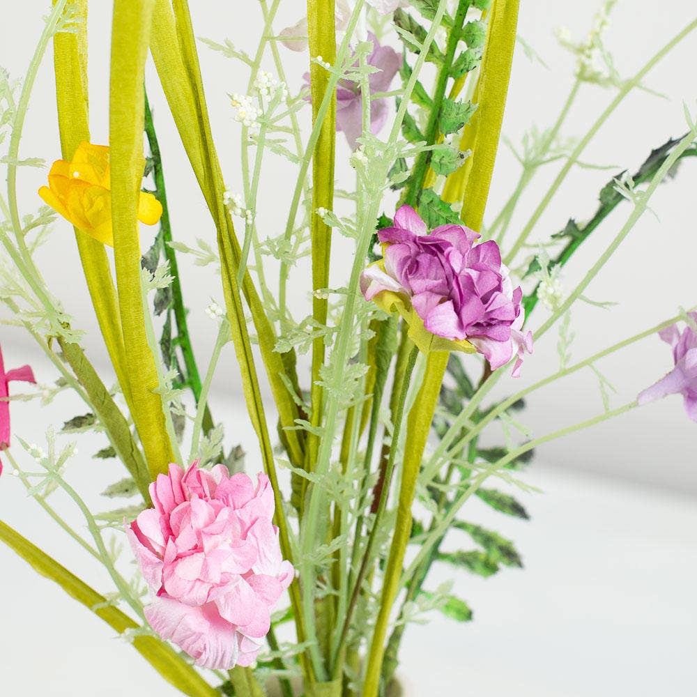 Close-up view of mixed wildflower stem showing detailed polysilk flower construction and natural spring color variations