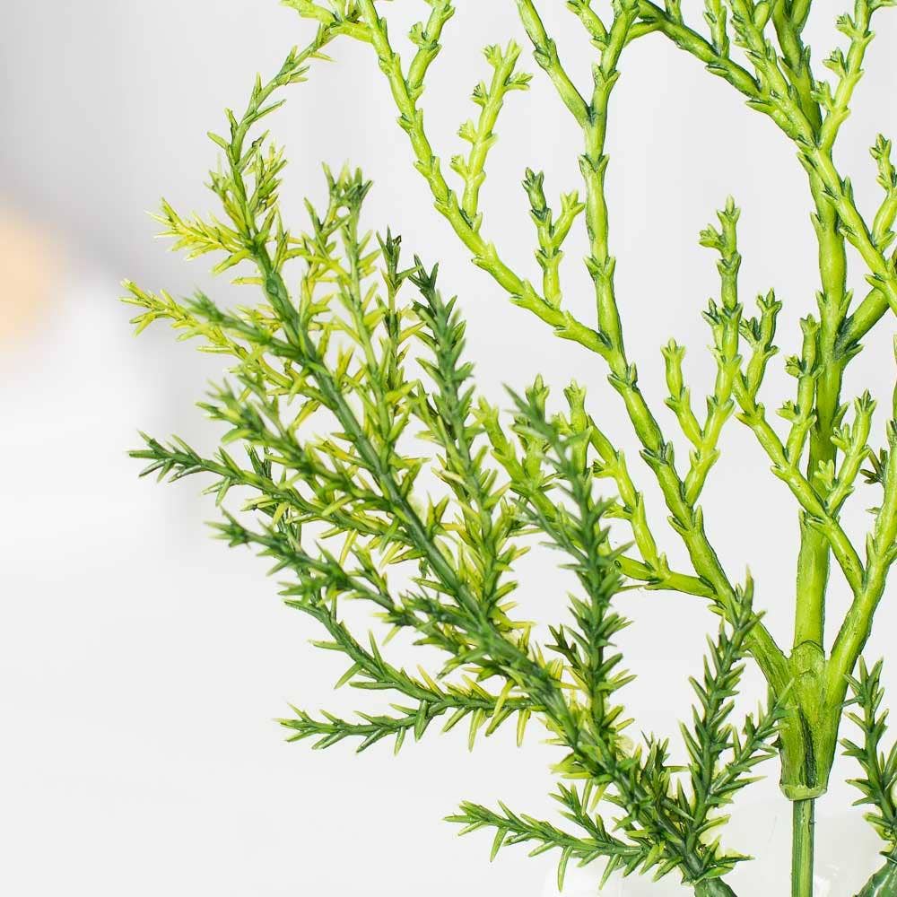 Multiple weatherproof cypress pine picks arranged showing consistent quality and realistic outdoor greenery appearance