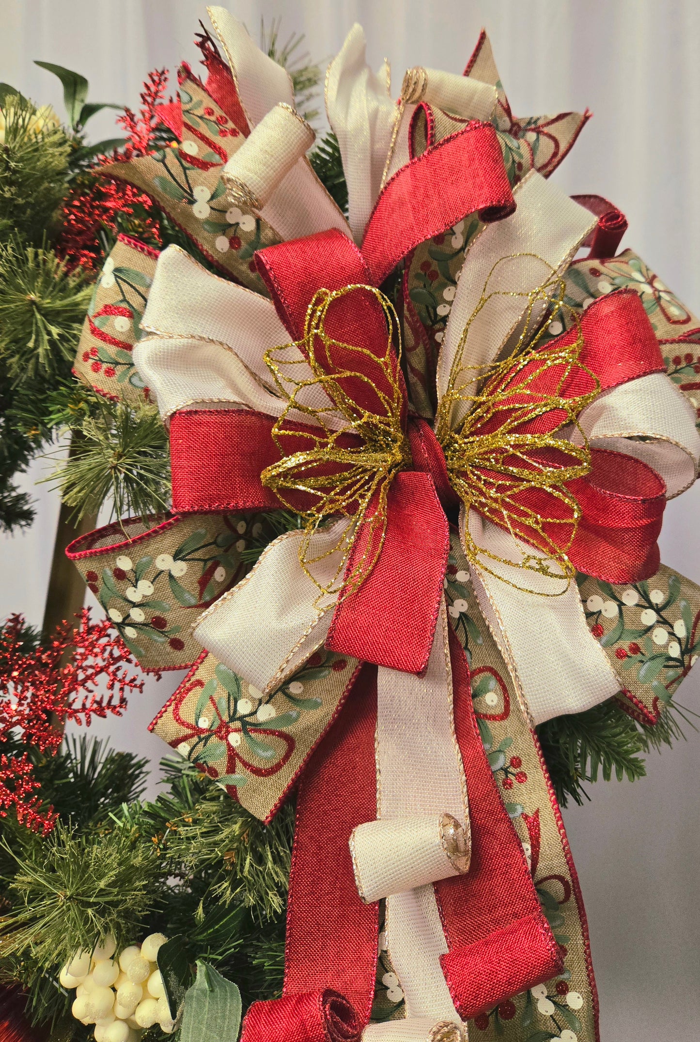 18″ Christmas wreath in red, white, and gold with luxurious premium ribbon