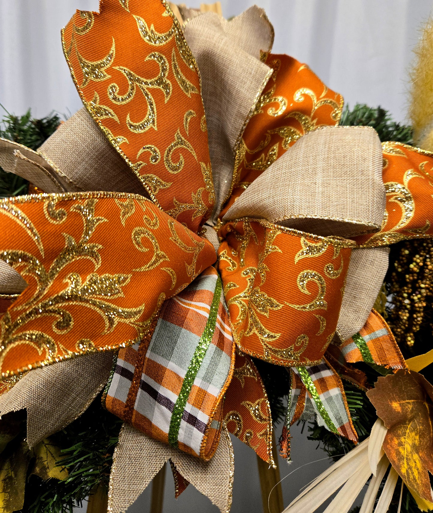 16″ fall wreath with orange, brown, and cream florals, berries, pumpkins, jewels, and coordinating bow