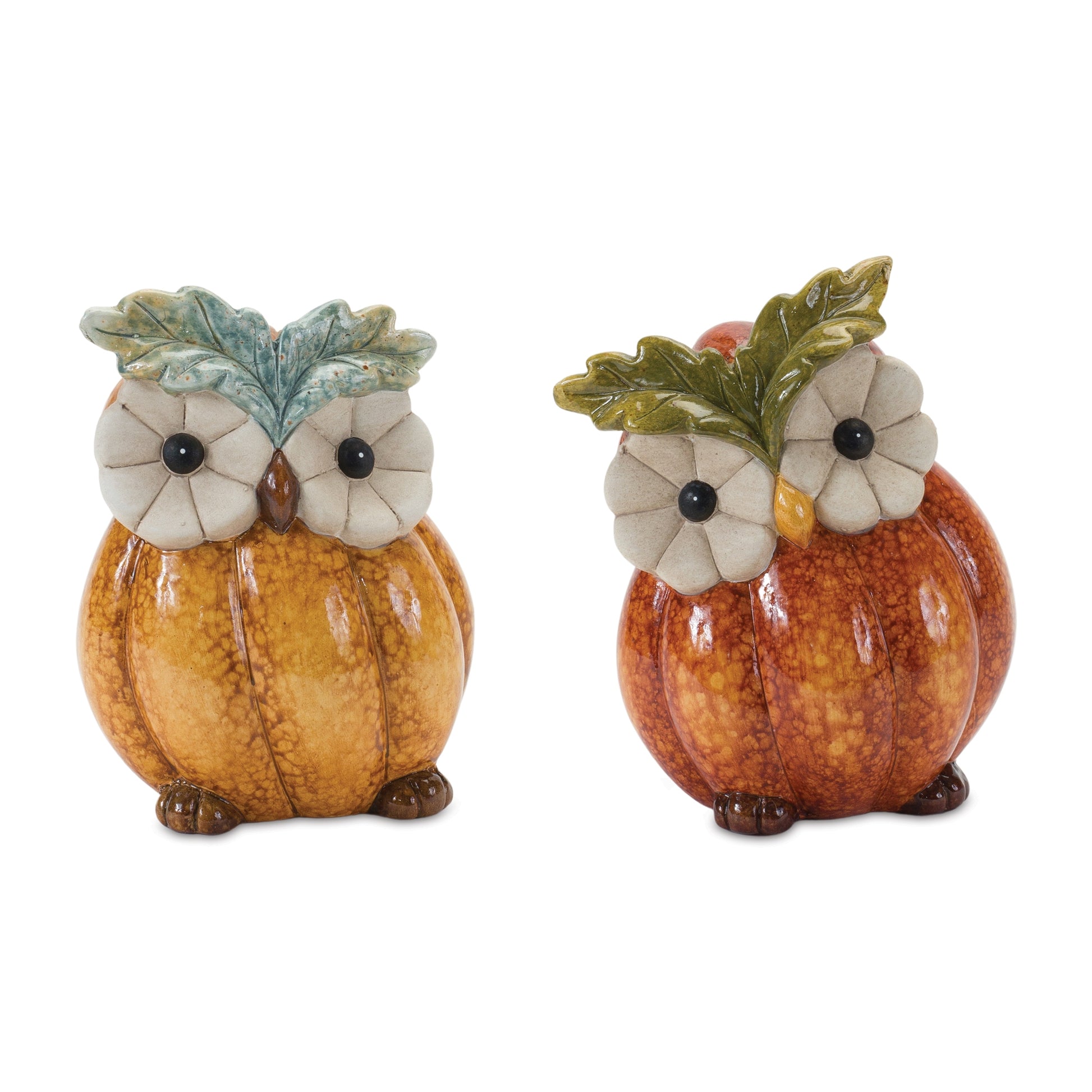 Two terra cotta owl figurines with pumpkin and leaf accents for fall décor