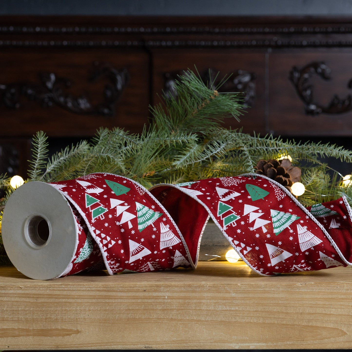 Holiday 4″ × 10 yd wired cotton ribbon with red and green Christmas tree design—ideal for bows, wreaths, and gift crafts