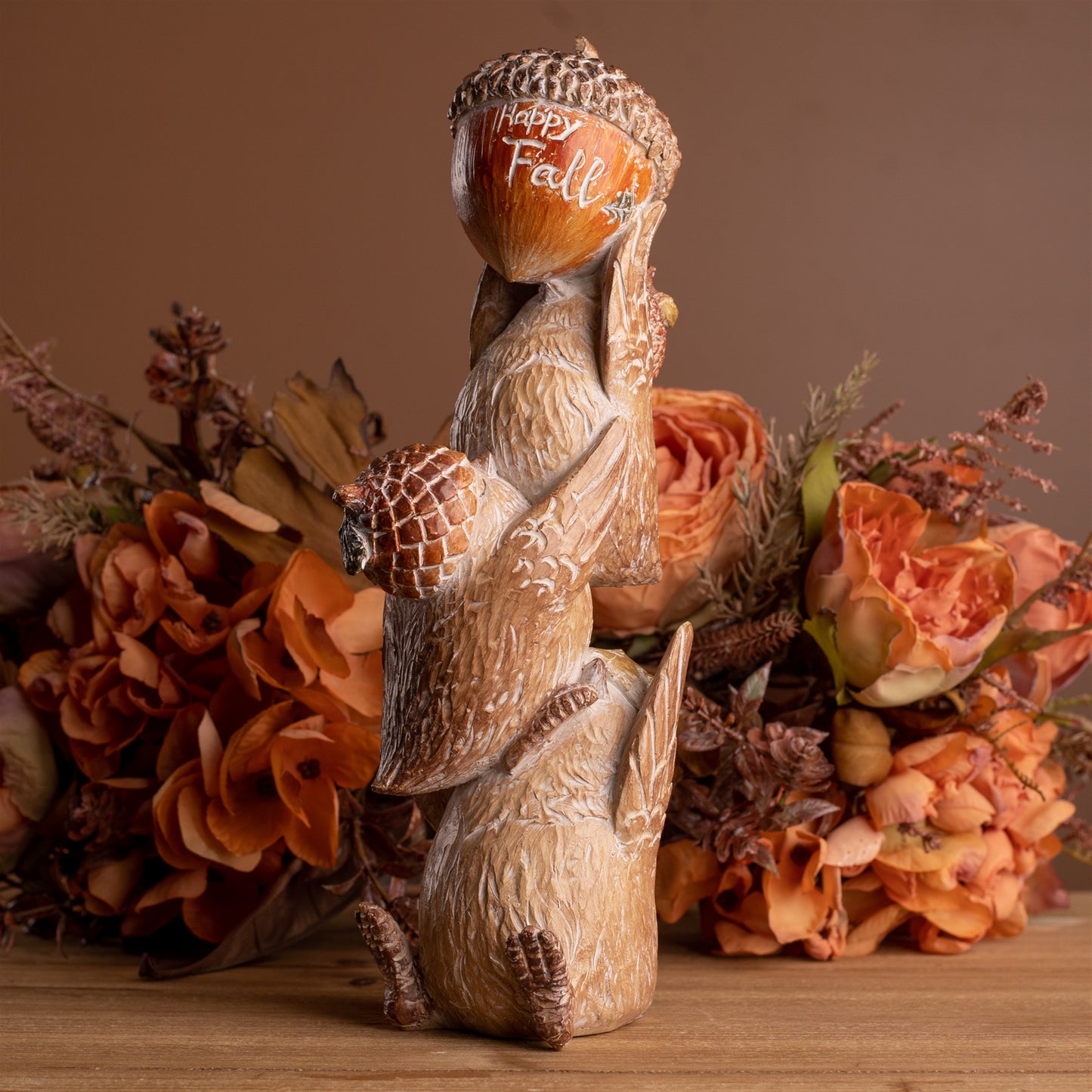Two stacked woodland bird figurines with acorn hats, warm autumn hues and etched wood design
