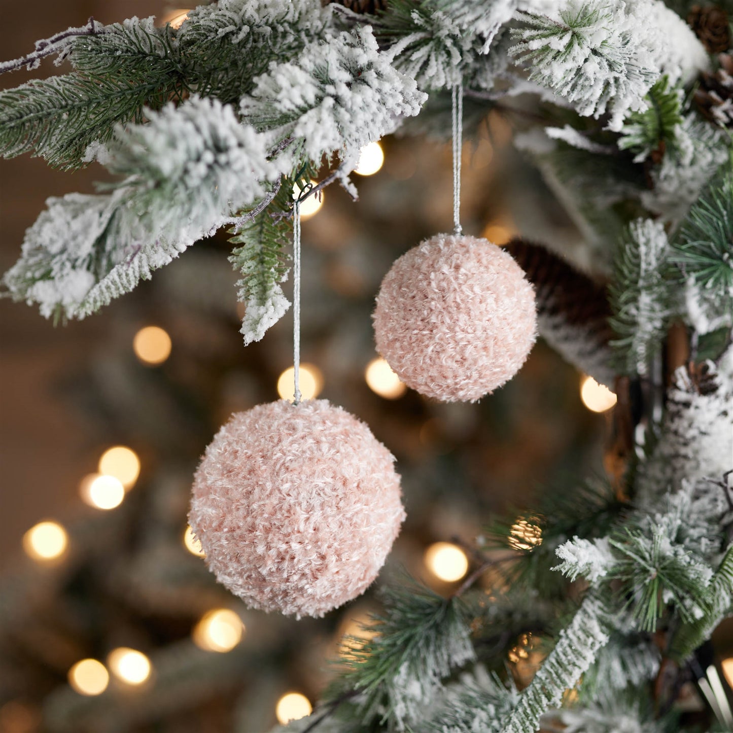 Assortment of 3-inch and 4-inch pink furry ornaments