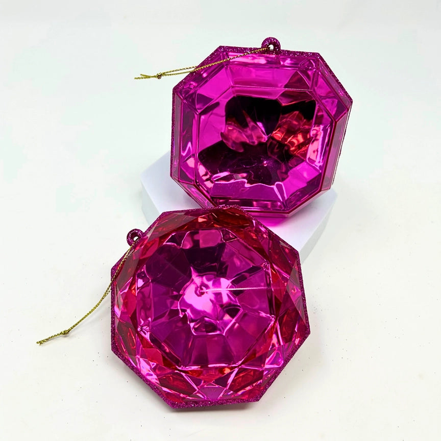 A 4-inch fuchsia pink, multi-faceted gem ornament in a teardrop shape, hanging against a white background.
