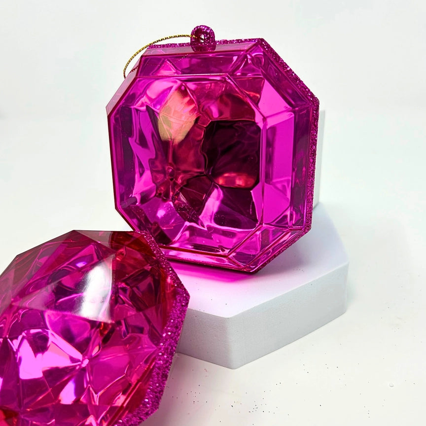 A 4-inch fuchsia pink, multi-faceted gem ornament in a teardrop shape, hanging against a white background.