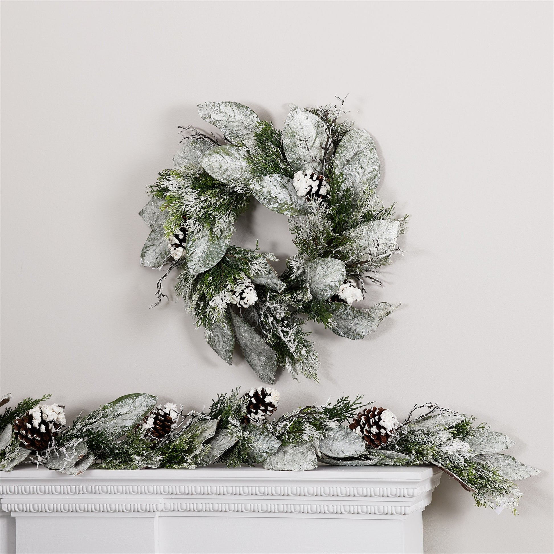 22-inch-wreath featuring cedar and magnolia leaves in lush green plastic suitable for festive indoor or covered outdoor display
