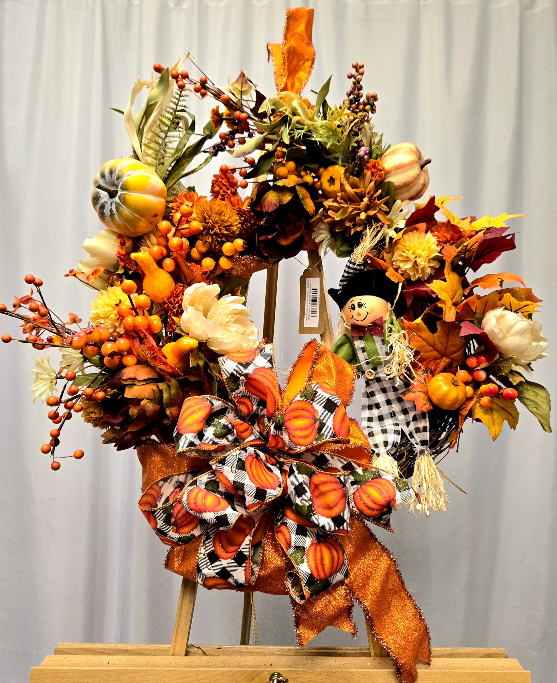 12″ Fall Scarecrow Wreath with pumpkin, florals, berries, and multi-ribbon bow
