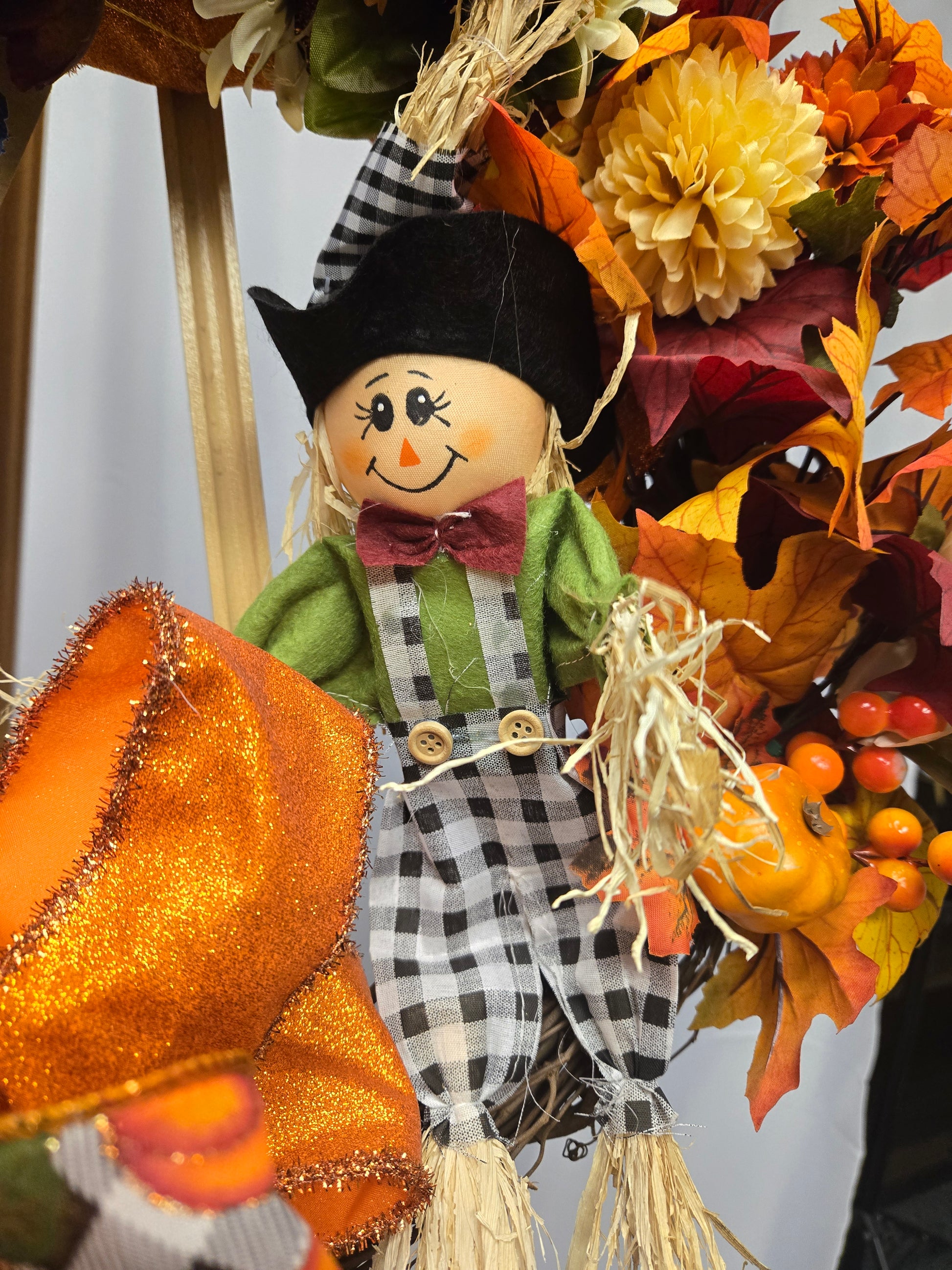 12″ Fall Scarecrow Wreath with pumpkin, florals, berries, and multi-ribbon bow
