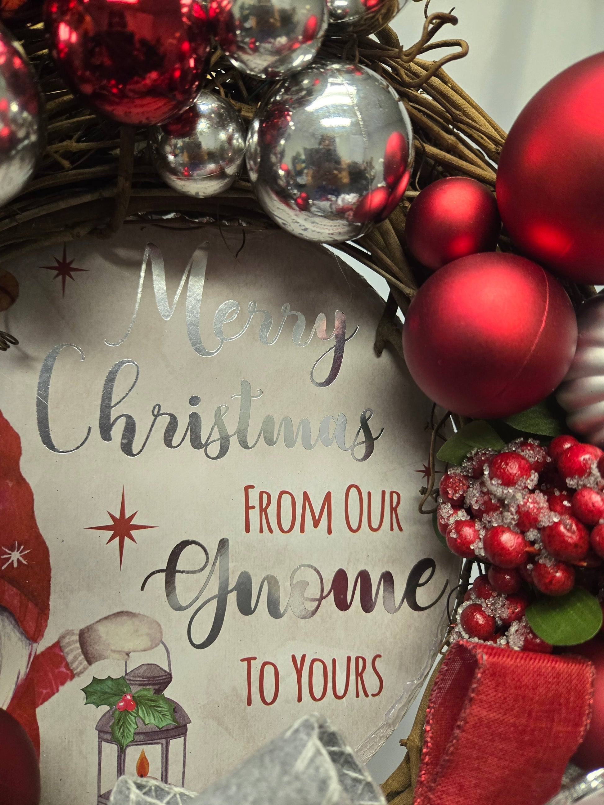 12″ Christmas wreath in red, silver, and white featuring a whimsical gnome accent
