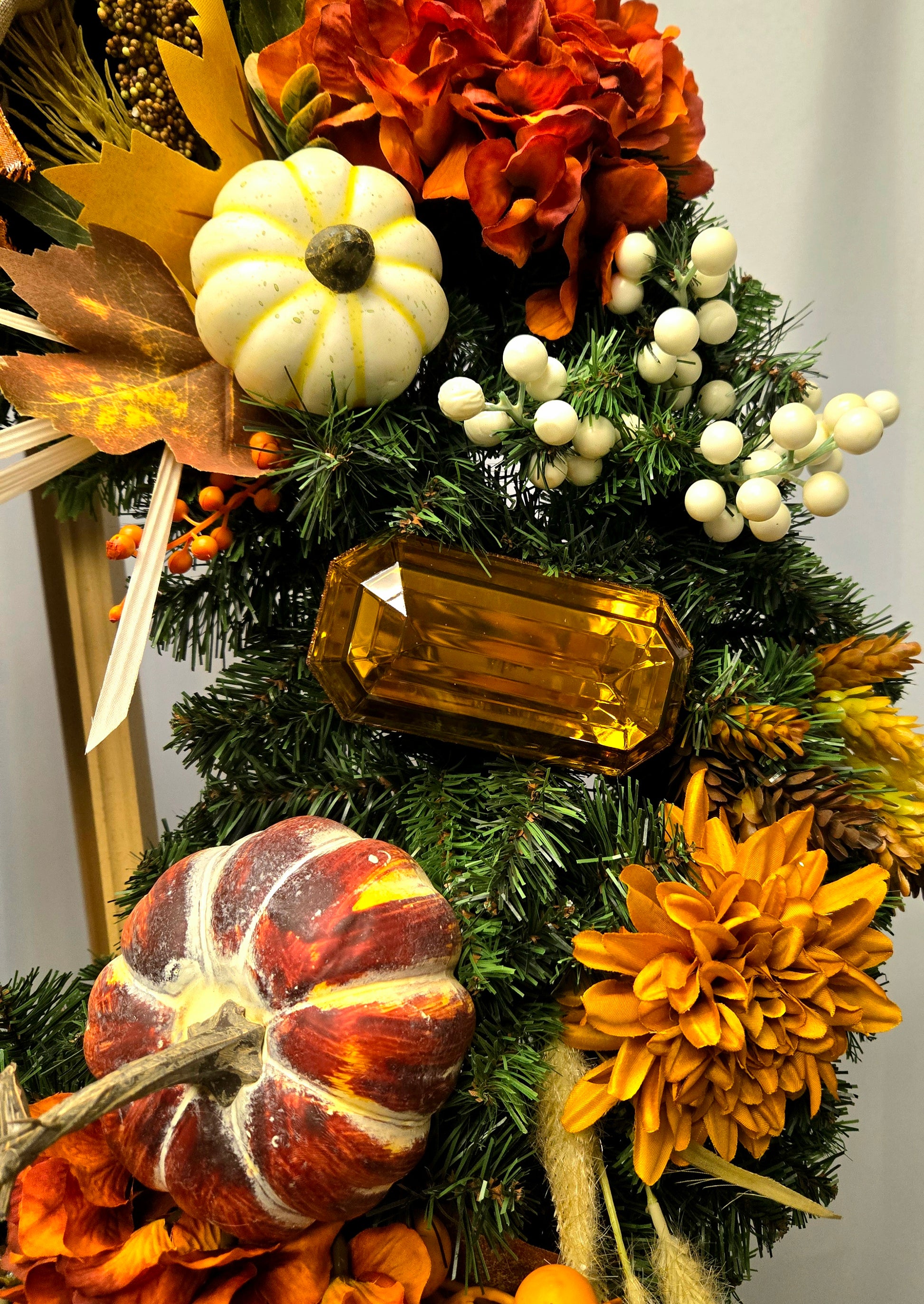 16″ fall wreath with orange, brown, and cream florals, berries, pumpkins, jewels, and coordinating bow
