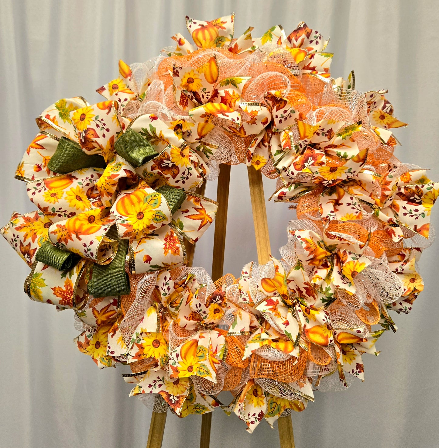 16″ fall wreath with orange, yellow, white & green deco-mesh and fall-themed ribbon on a wire wreath form
