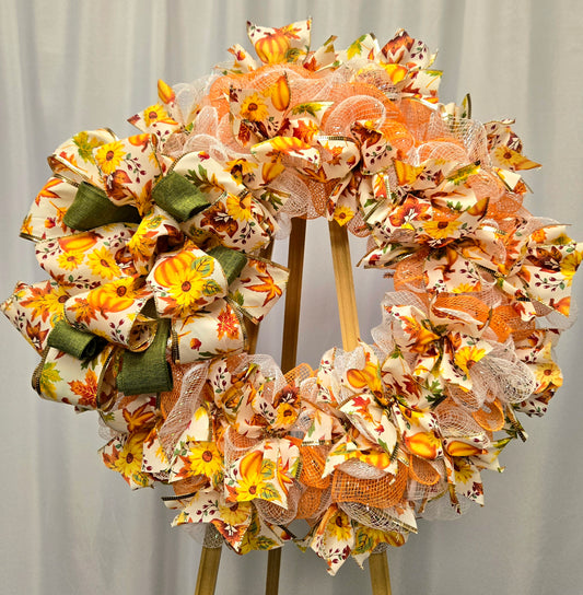16″ fall wreath with orange, yellow, white & green deco-mesh and fall-themed ribbon on a wire wreath form
