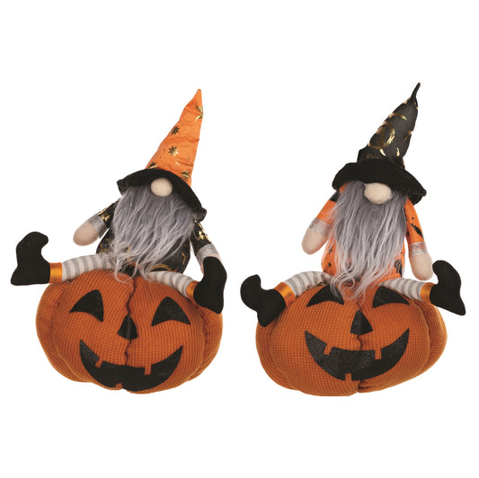 Two plush Halloween gnomes holding jack o’lanterns, soft fabric spooky accents

