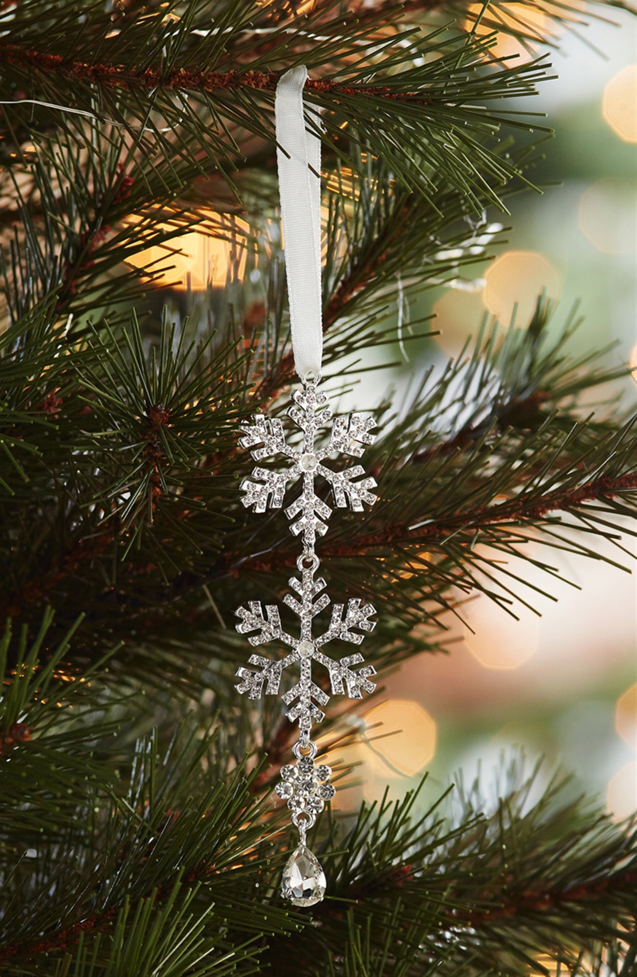 A single, elegant 4.5-inch tiered snowflake drop ornament with sparkling clear jewel accents, hanging against a white background.