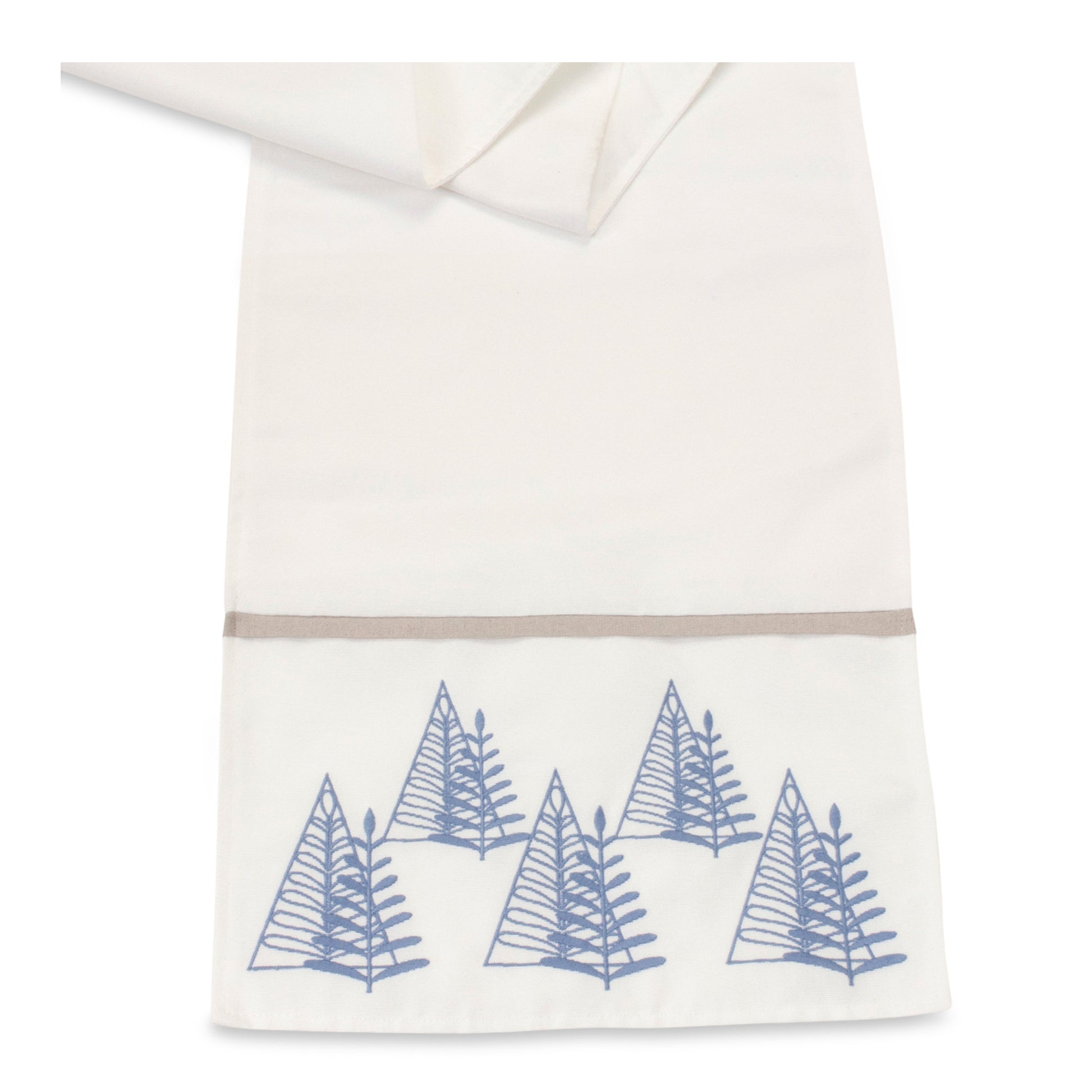 Close-up of minimalist embroidered pine tree on a white table runner