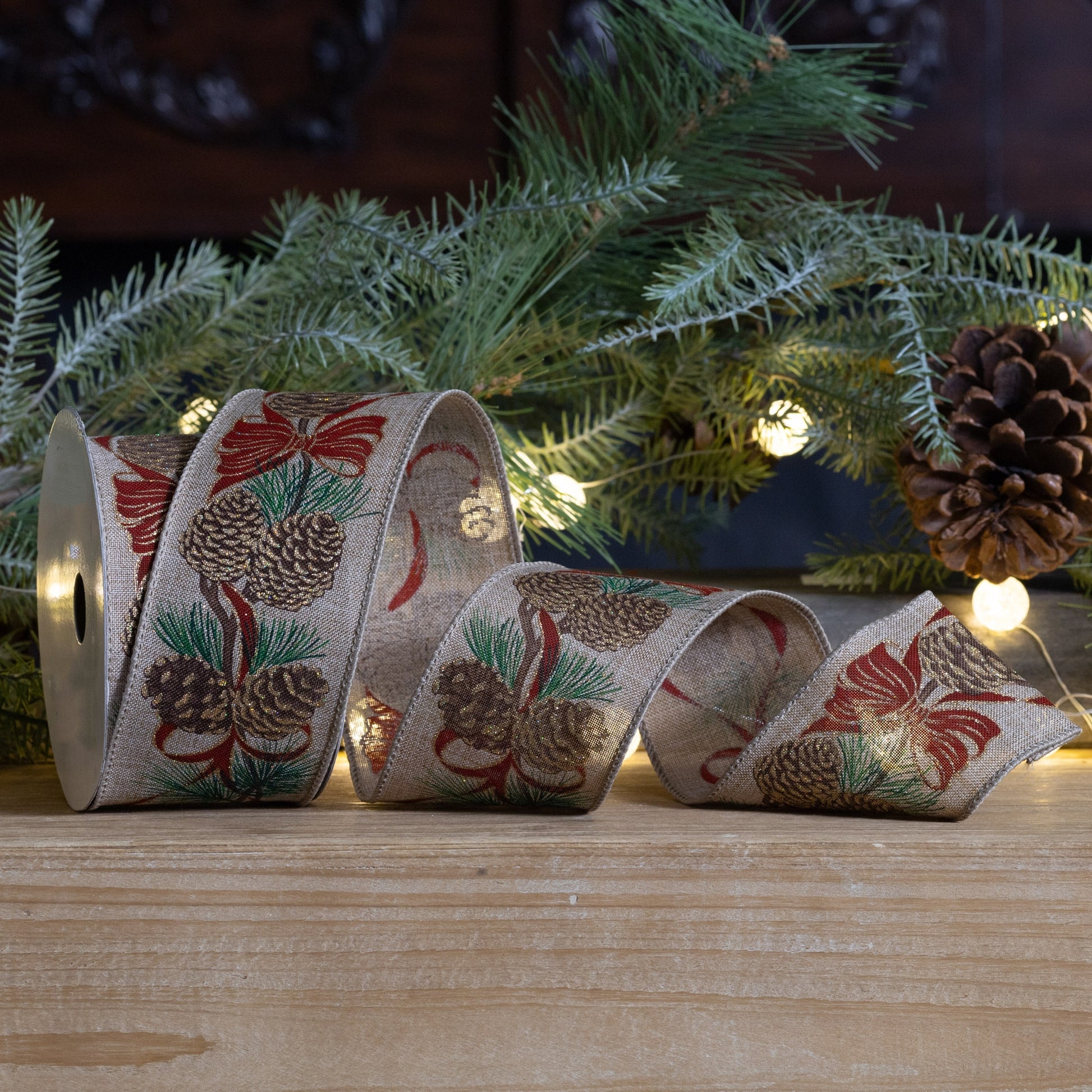 Wired polyester ribbon, set of 2 (2.5″ × 10 yd each), pinecone pattern in red, beige, and green with wired edges for shaping décor
