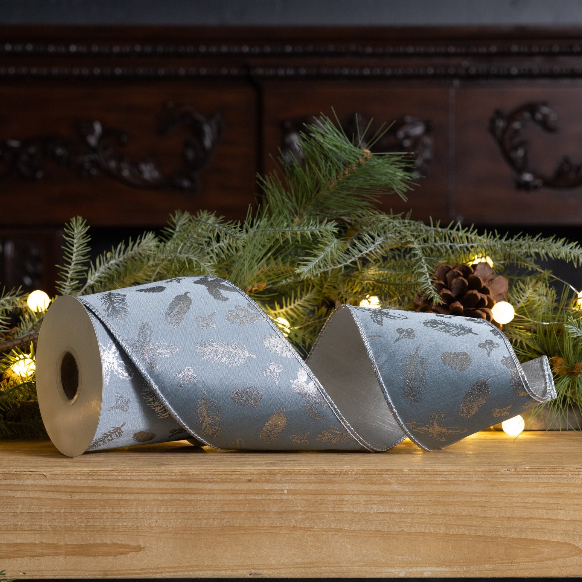Blue and silver botanical wired ribbon, 4″ × 10 yd roll with metallic leaf design and wired edges for crafting bows, wreaths, and décor
