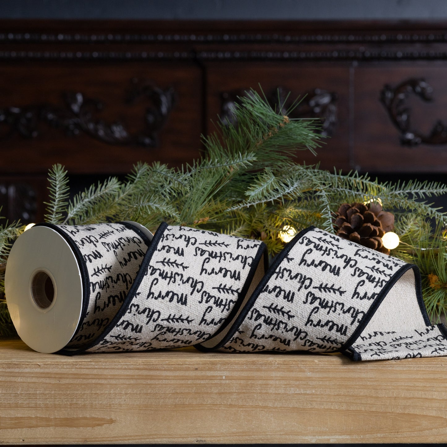 Wired cotton ribbon 4″ × 5 yd featuring black and beige “Merry Christmas” text—perfect for bows, wreaths, and festive crafts

