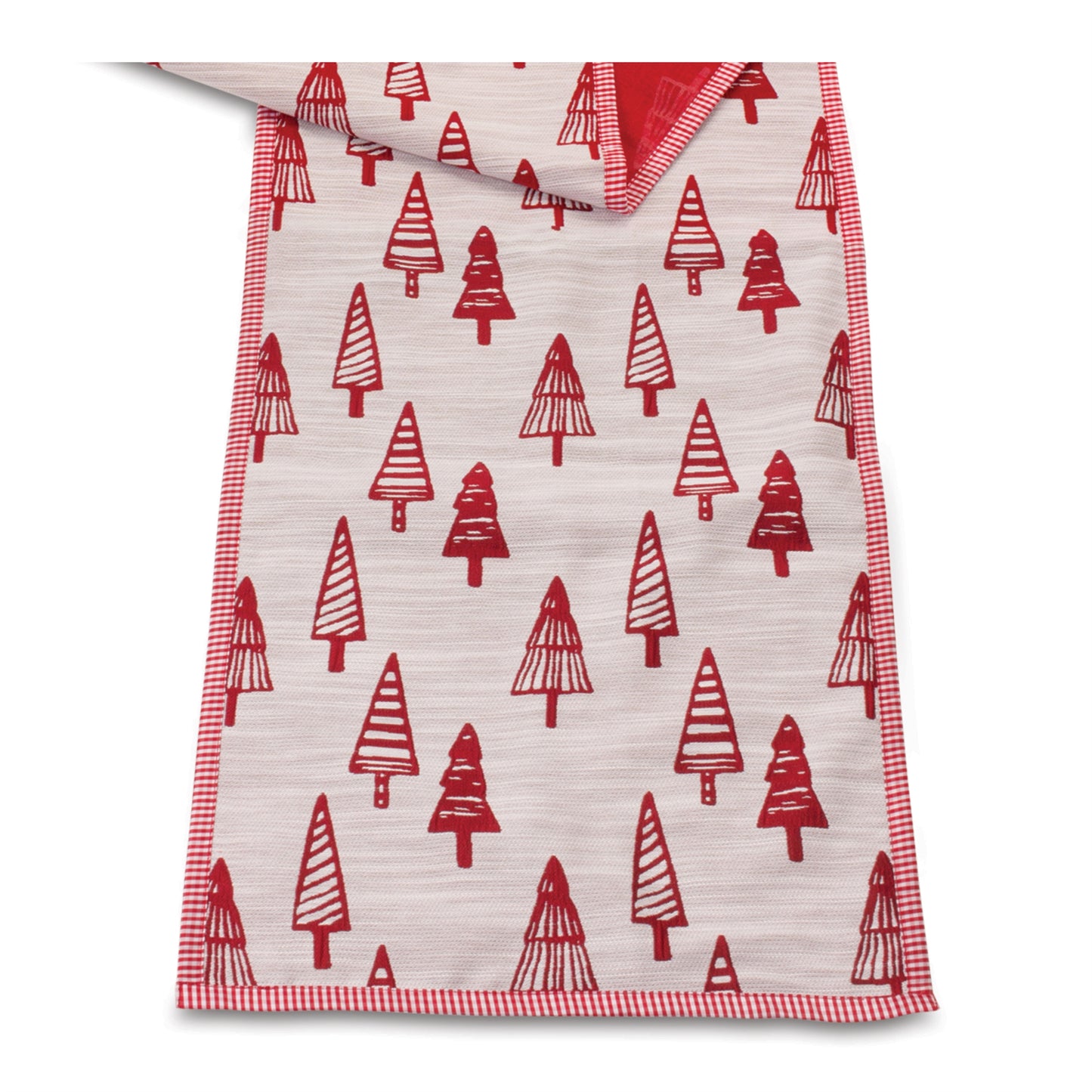 Close-up of white embroidered pine tree on red table runner