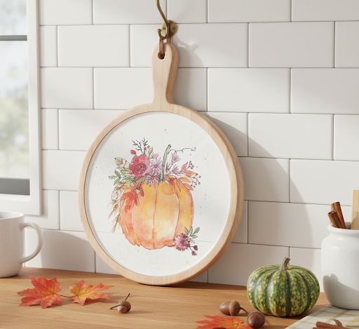 Pair of pine wood cutting boards featuring watercolor pumpkin art and convenient hanging holes
