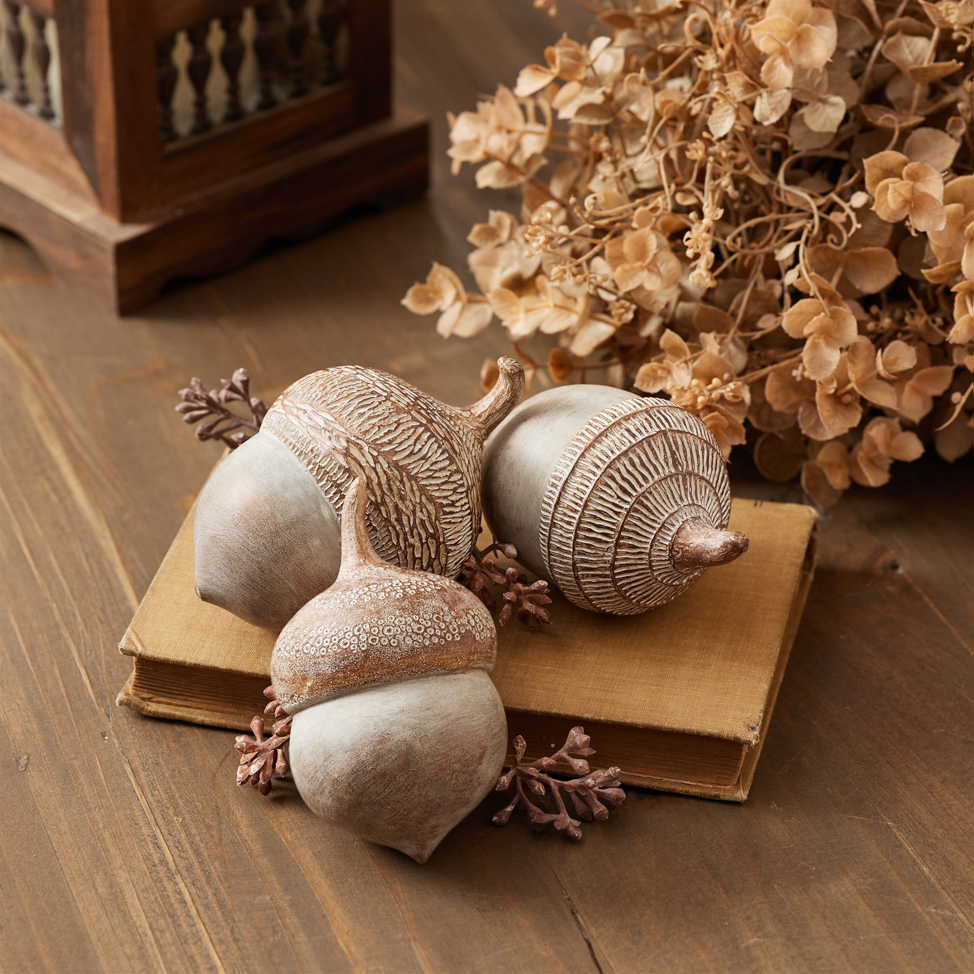 Set of six white washed acorns with etched tops in warm beige tones for rustic fall décor

