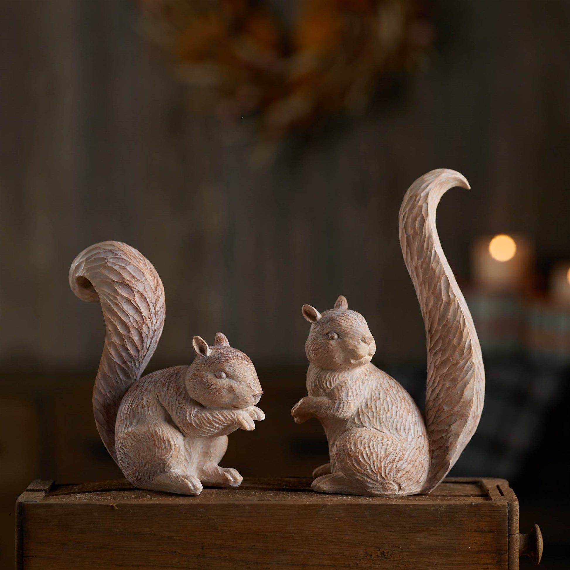 Pair of white-washed and etched squirrel figurines in brown and beige tones for fall décor
