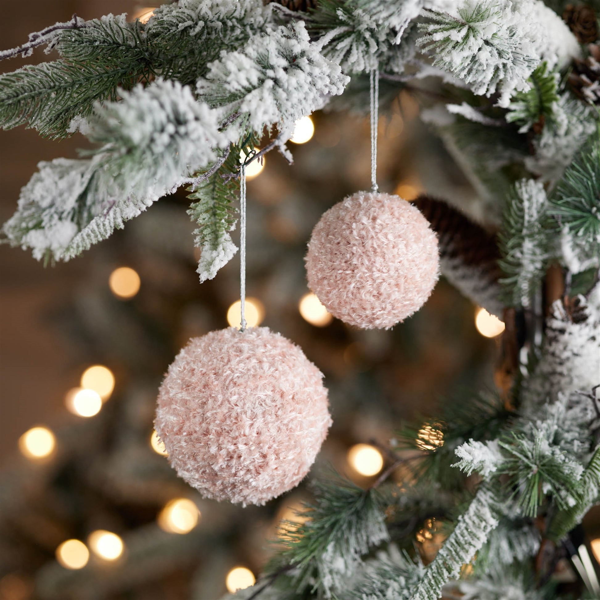 Assortment of 3-inch and 4-inch pink furry ornaments