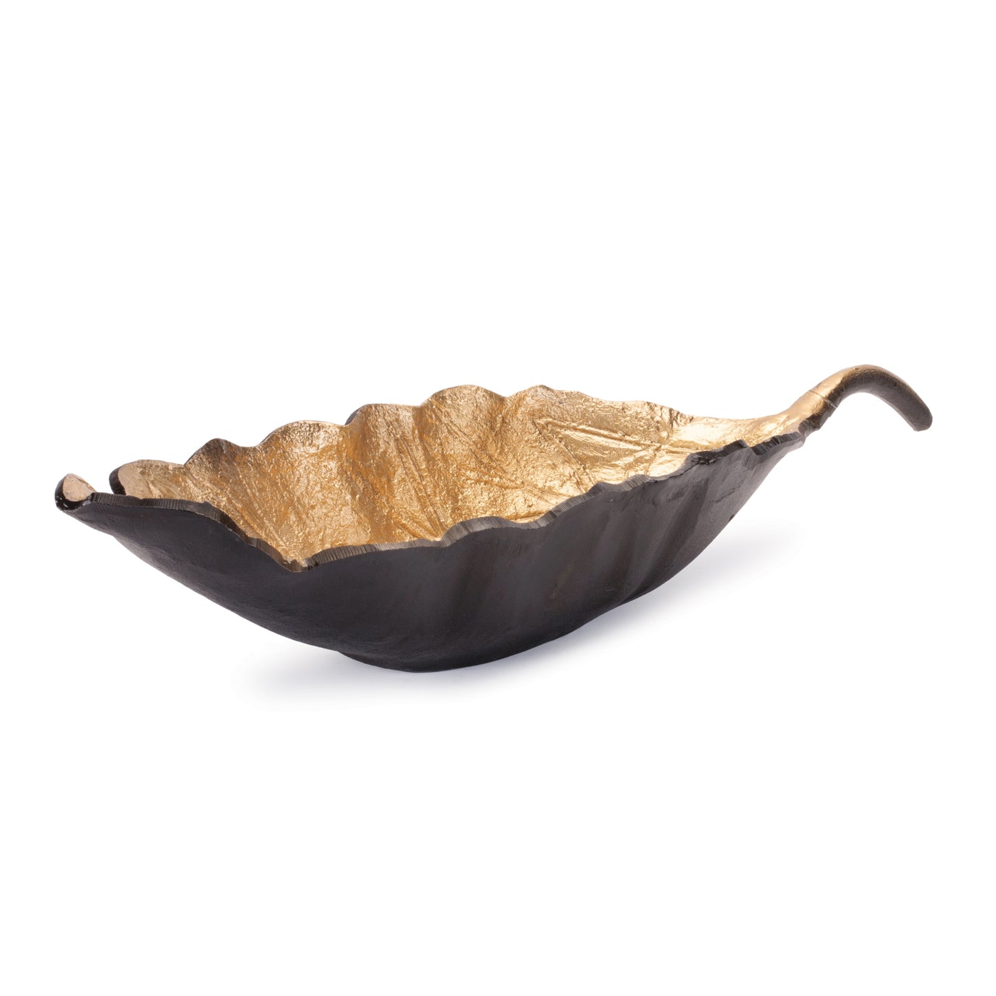 Long metallic leaf bowl styled as a centerpiece on a dining table