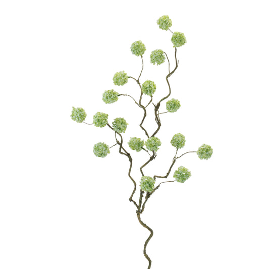 Close up detail of soft green snowball flowers and brown stems on faux branch