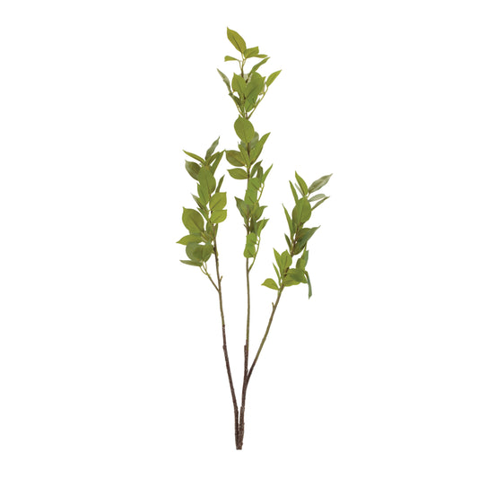 Close-up of realistic green fabric leaves on a faux twig branch