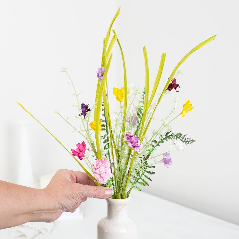 Artificial wildflowers stem arranged in spring centerpiece showing versatile seasonal decorating and arrangement applications