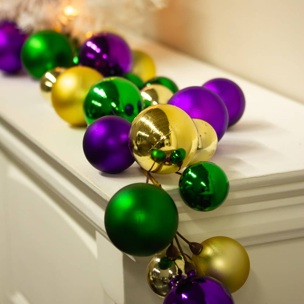 5-ft Mardi Gras garland featuring large purple, gold, and green ball ornaments—ideal for festive décor
